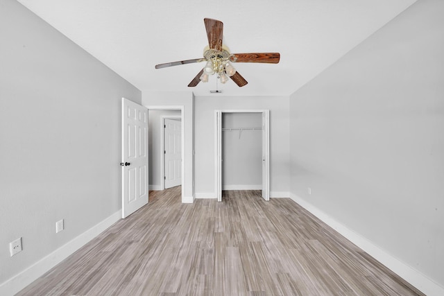 139 NE Royce Ave, Port Saint Lucie, FL 34983 - unfurnished bedroom with baseboards, a closet, light wood finished floors, and ceiling fan