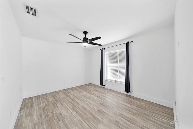 139 NE Royce Ave, Port Saint Lucie, FL 34983 - unfurnished room with light wood finished floors, ceiling fan, and baseboards