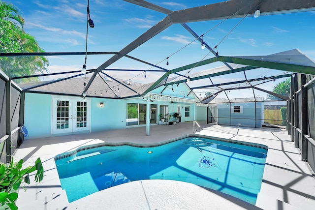 139 NE Royce Ave, Port Saint Lucie, FL 34983 - outdoor pool featuring french doors, a patio, and a lanai