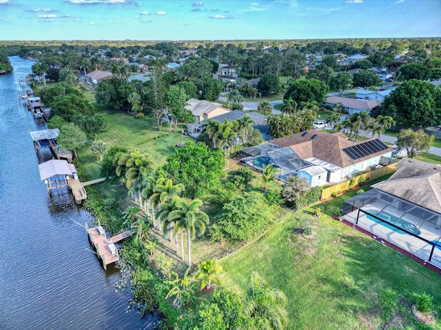 139 NE Royce Ave, Port Saint Lucie, FL 34983 - aerial view of residential area featuring a nearby body of water and a tree filled landscape