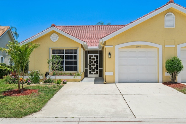 single story home with stucco siding, a tiled roof, concrete driveway, and a garage