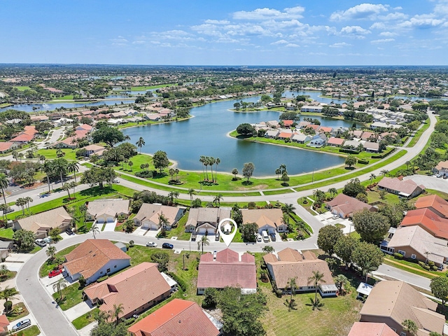aerial perspective of suburban area featuring a nearby body of water