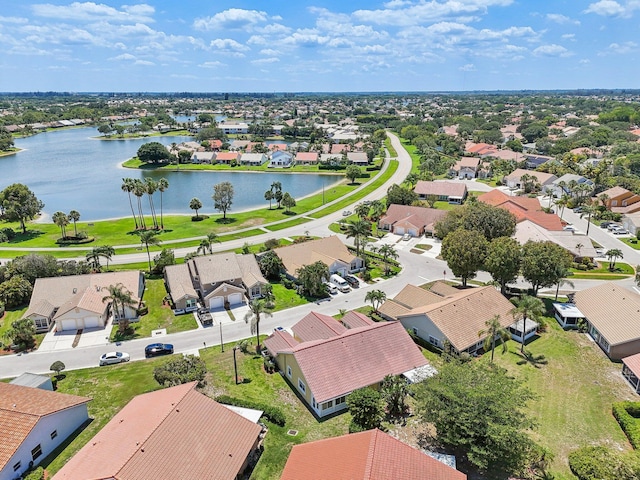 aerial view of residential area with a large body of water