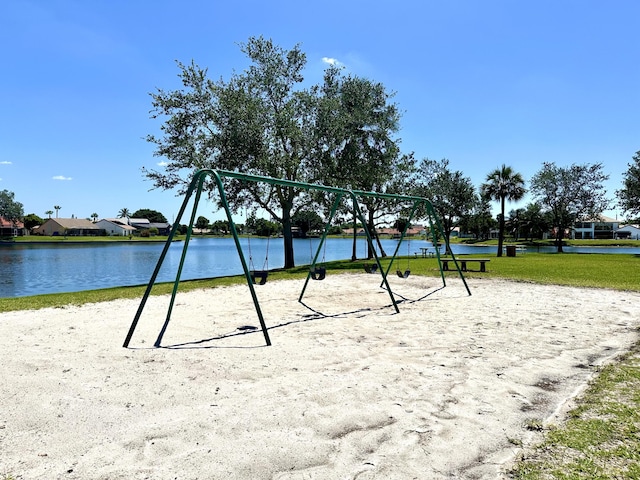 surrounding community featuring a water view