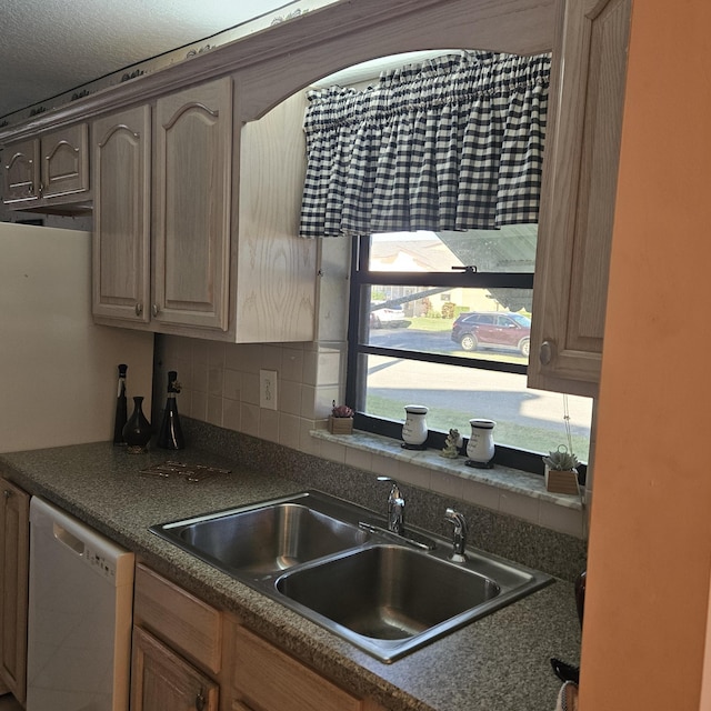 1779 W Royal Tern 1 Ln Unit 1, Fort Pierce, FL 34982 - kitchen with a sink, white dishwasher, decorative backsplash, and dark countertops