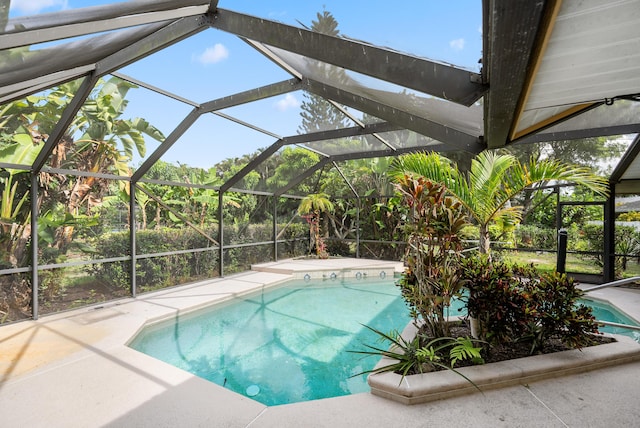 620 SE Stow Ter, Port Saint Lucie, FL 34984 - swimming pool featuring a patio area and a lanai