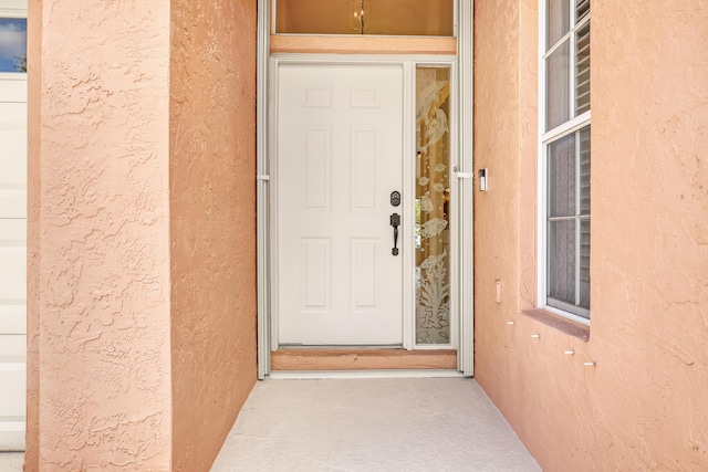 3035 Casa Rio Ct, Riviera Beach, FL 33418 - doorway to property with stucco siding