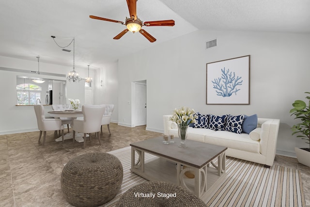 3035 Casa Rio Ct, Riviera Beach, FL 33418 - living area featuring vaulted ceiling, baseboards, ceiling fan, and a chandelier