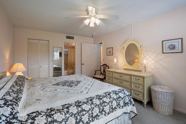 bedroom featuring a closet, carpet, ceiling fan, and connected bathroom