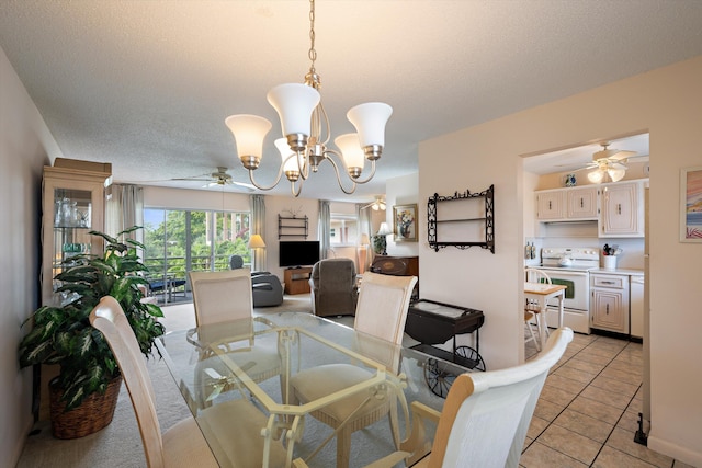 dining room with ceiling fan, a chandelier, and light tile patterned flooring