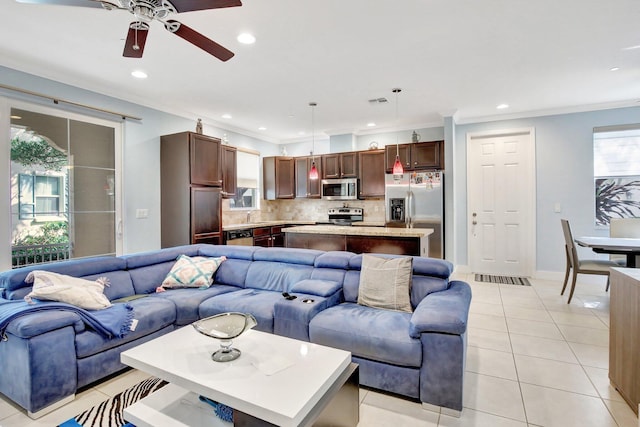 4128 Cascada Cir, Cooper City, FL 33024 - living area featuring a ceiling fan, crown molding, light tile patterned flooring, recessed lighting, and baseboards