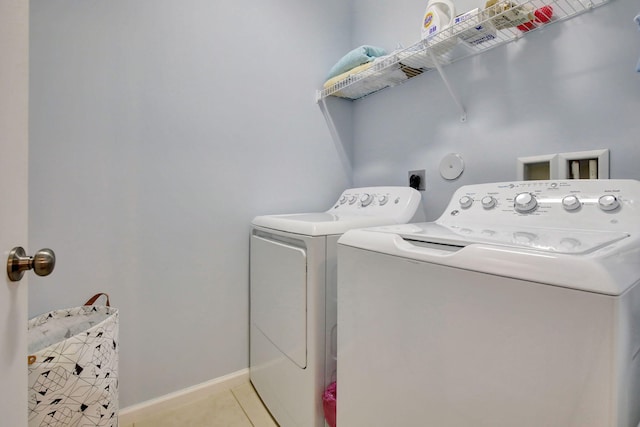 4128 Cascada Cir, Cooper City, FL 33024 - laundry room with separate washer and dryer, light tile patterned floors, and baseboards