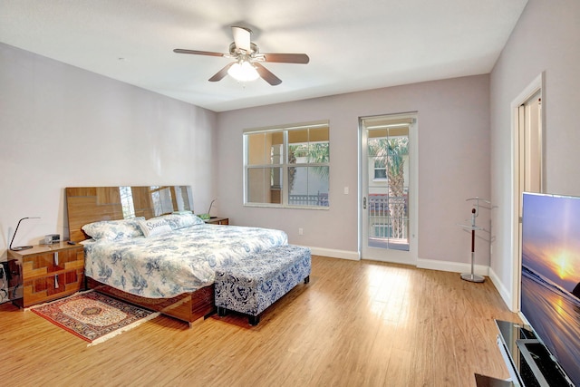 4128 Cascada Cir, Cooper City, FL 33024 - bedroom with access to exterior, wood finished floors, baseboards, and a ceiling fan