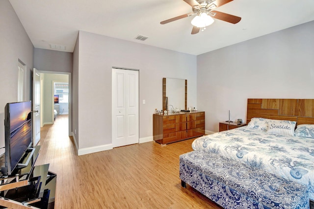4128 Cascada Cir, Cooper City, FL 33024 - bedroom with light wood finished floors, a closet, baseboards, and ceiling fan