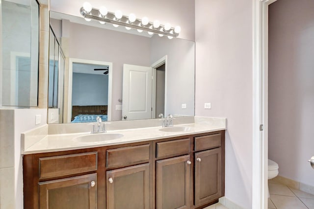 4128 Cascada Cir, Cooper City, FL 33024 - bathroom with double vanity, tile patterned floors, toilet, tiled shower, and connected bathroom
