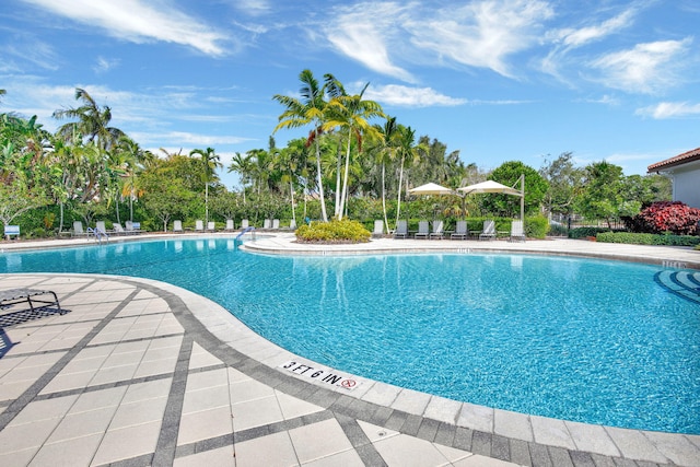 4128 Cascada Cir, Cooper City, FL 33024 - community pool featuring a patio area