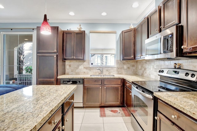 4128 Cascada Cir, Cooper City, FL 33024 - kitchen with stainless steel appliances, a sink, light tile patterned floors, crown molding, and tasteful backsplash