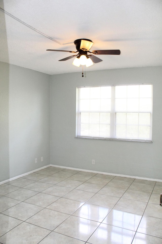 1500 SE Royal Green Cir Unit 208, Port Saint Lucie, FL 34952 - unfurnished room with a ceiling fan, baseboards, and light tile patterned floors
