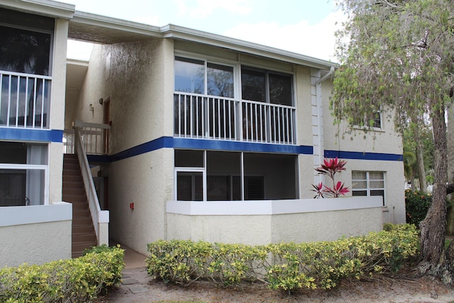1500 SE Royal Green Cir Unit 208, Port Saint Lucie, FL 34952 - view of building exterior featuring stairs