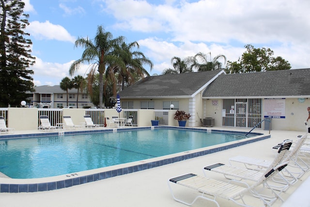 1500 SE Royal Green Cir Unit 208, Port Saint Lucie, FL 34952 - community pool with fence, central air condition unit, and a patio area