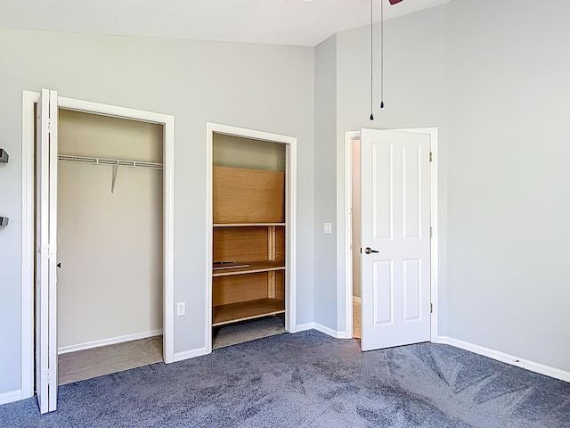 unfurnished bedroom featuring carpet, baseboards, and a closet