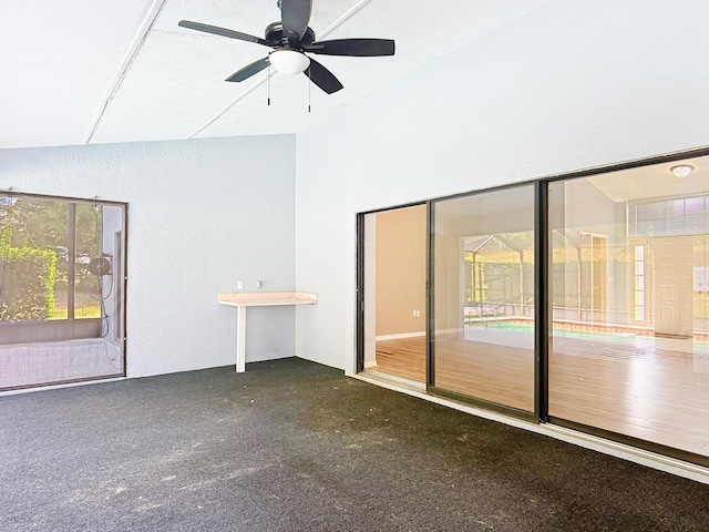 spare room featuring ceiling fan and high vaulted ceiling