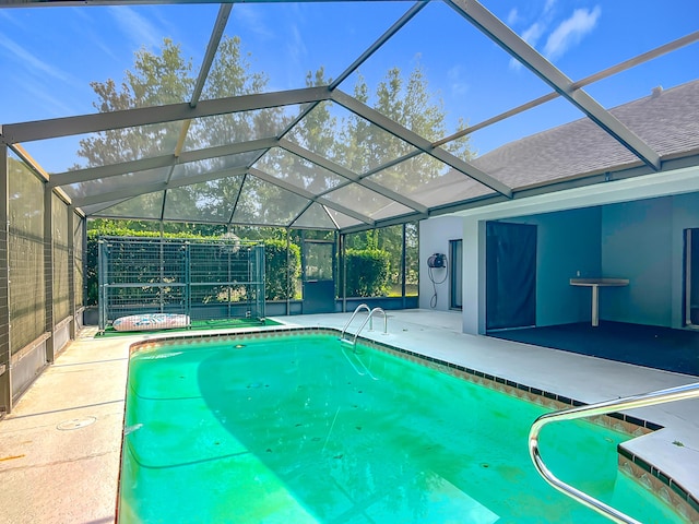 outdoor pool featuring a patio and a lanai