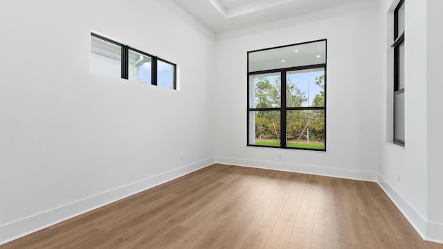 13250 Artisan Cir, Palm Beach Gardens, FL 33418 - empty room featuring wood finished floors and baseboards
