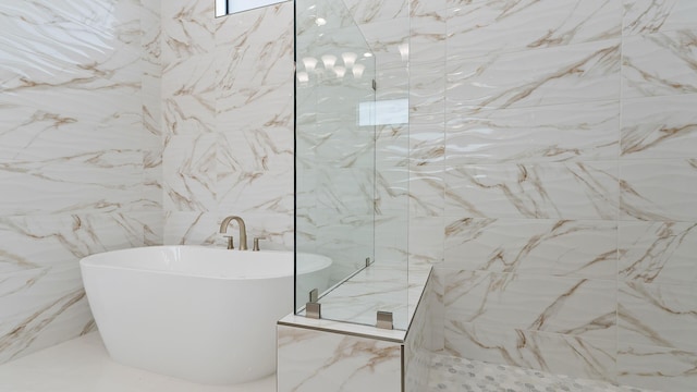 13250 Artisan Cir, Palm Beach Gardens, FL 33418 - bathroom with a soaking tub, a walk in shower, marble tiled floors, and tile walls
