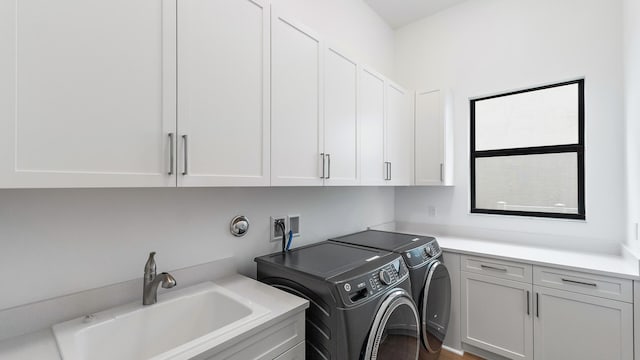 13250 Artisan Cir, Palm Beach Gardens, FL 33418 - laundry room featuring cabinet space and washer and dryer