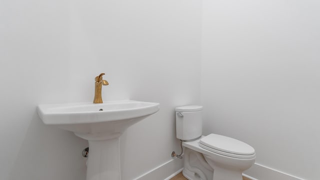 13250 Artisan Cir, Palm Beach Gardens, FL 33418 - half bath with toilet and baseboards