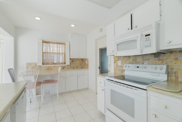 631 SW 21st Cir, Boynton Beach, FL 33426 - kitchen featuring white appliances, decorative backsplash, light countertops, white cabinetry, and recessed lighting