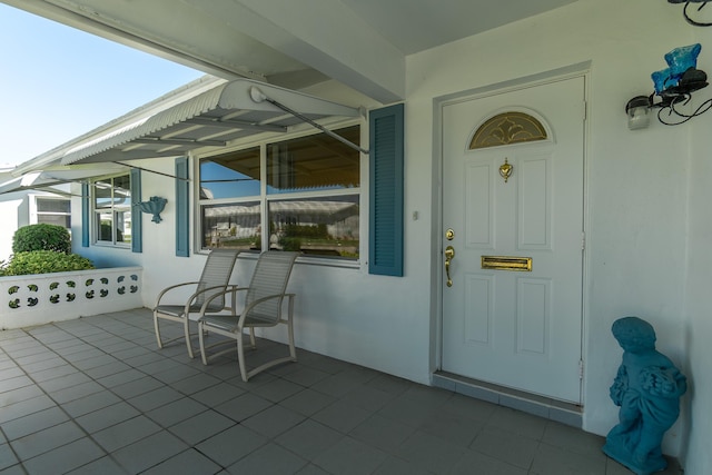 doorway to property featuring covered porch