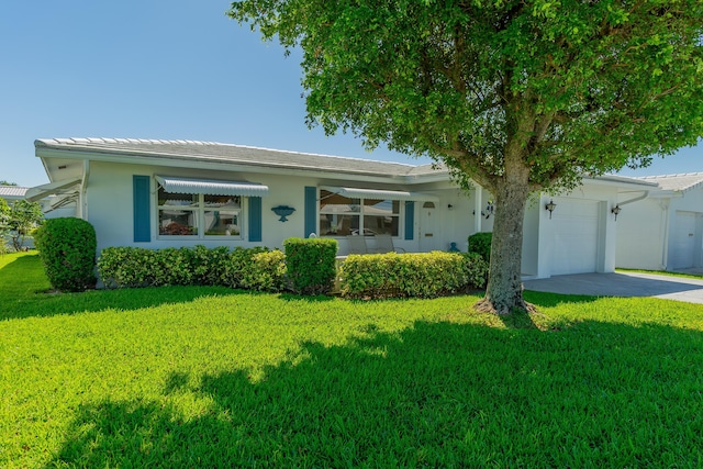 631 SW 21st Cir, Boynton Beach, FL 33426 - single story home with driveway, a garage, a front yard, and stucco siding