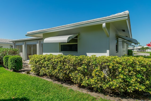 view of home's exterior with stucco siding