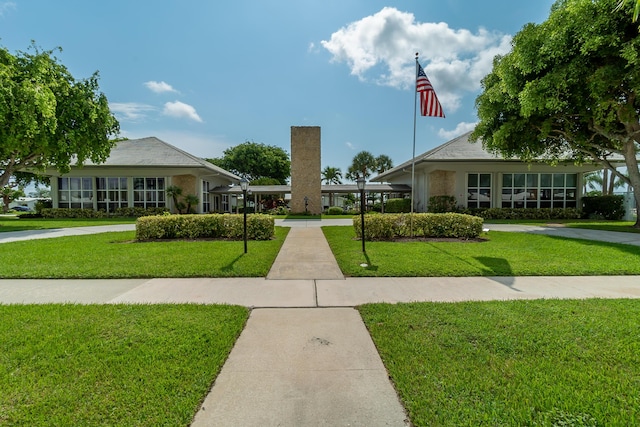 view of community featuring a yard