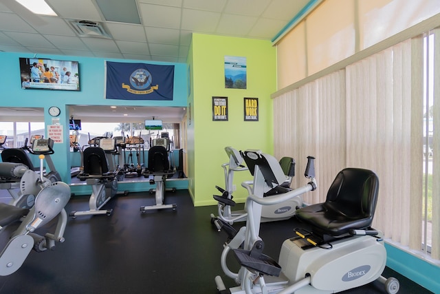 workout area featuring a paneled ceiling