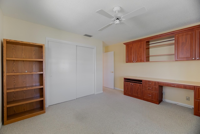 631 SW 21st Cir, Boynton Beach, FL 33426 - unfurnished office with built in desk, light carpet, a ceiling fan, and baseboards