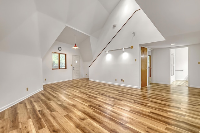 1130 Melinda Ln, Haverhill, FL 33417 - unfurnished living room with light wood-type flooring and baseboards