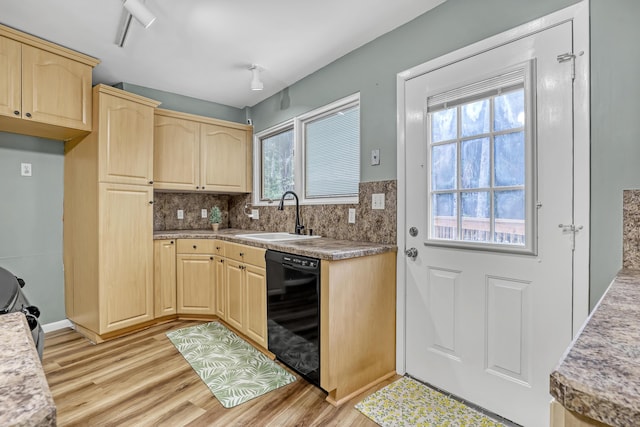 1130 Melinda Ln, Haverhill, FL 33417 - kitchen with black dishwasher, light brown cabinets, a sink, and light wood-type flooring