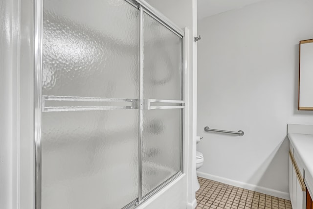 1130 Melinda Ln, Haverhill, FL 33417 - bathroom featuring vanity, toilet, bath / shower combo with glass door, tile patterned flooring, and baseboards