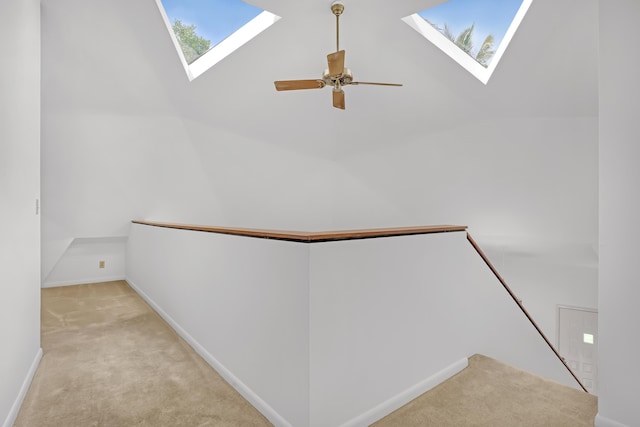 1130 Melinda Ln, Haverhill, FL 33417 - hallway with a skylight, carpet flooring, an upstairs landing, and vaulted ceiling