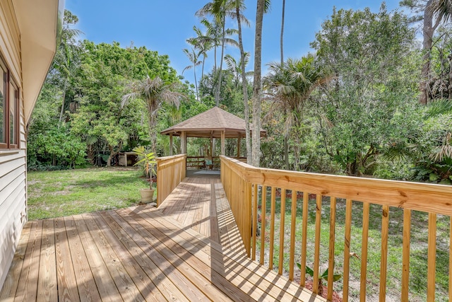 1130 Melinda Ln, Haverhill, FL 33417 - wooden terrace with a gazebo, a yard, and view of wooded area