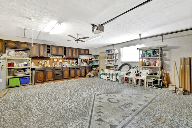472 SW Aster Rd, Port Saint Lucie, FL 34953 - garage with a garage door opener and a ceiling fan