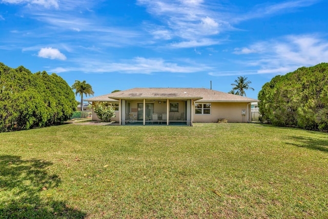 472 SW Aster Rd, Port Saint Lucie, FL 34953 - rear view of property with a sunroom and stucco siding