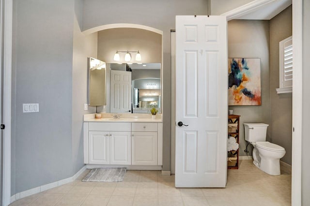 11354 Mainsail Ct, Wellington, FL 33449 - bathroom featuring vanity, tile patterned flooring, toilet, and baseboards