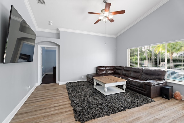 4620 SE Winter Haven Ct, Stuart, FL 34997 - living room featuring healthy amount of natural light, light wood finished floors, a ceiling fan, and ornamental molding