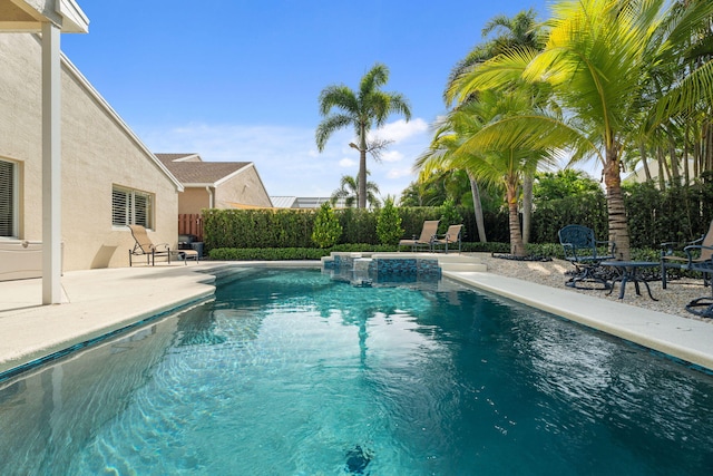 4620 SE Winter Haven Ct, Stuart, FL 34997 - view of pool featuring a fenced backyard, a patio area, and a pool with connected hot tub