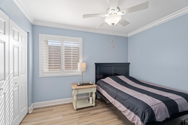 4620 SE Winter Haven Ct, Stuart, FL 34997 - bedroom featuring wood finished floors, a closet, ornamental molding, baseboards, and a ceiling fan