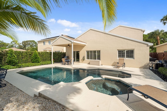4620 SE Winter Haven Ct, Stuart, FL 34997 - view of swimming pool featuring a patio area, ceiling fan, and a pool with connected hot tub